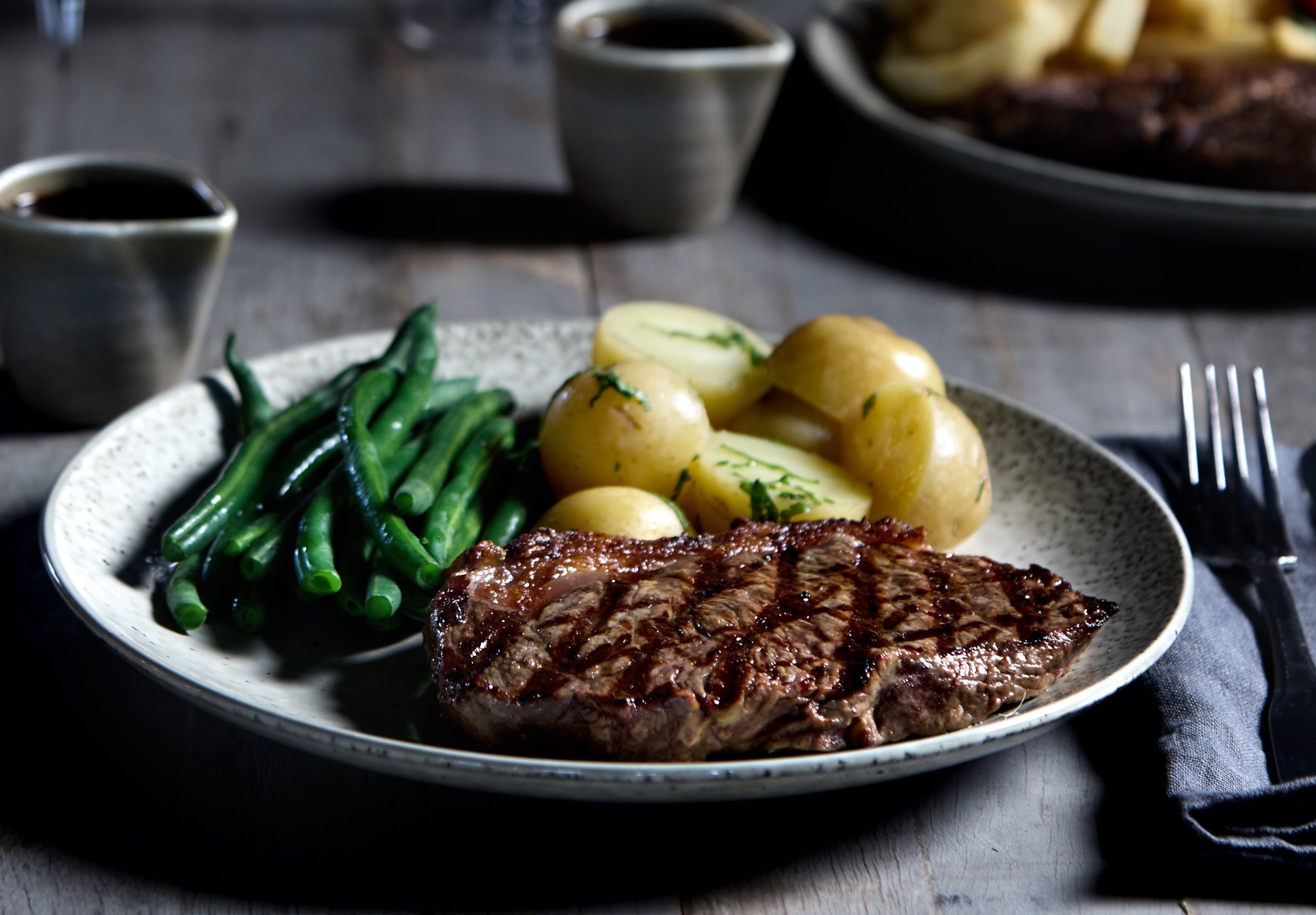 delicious and juicy premium portion cut sirloin, porterhouse, striploin steak in restaurant or pub.